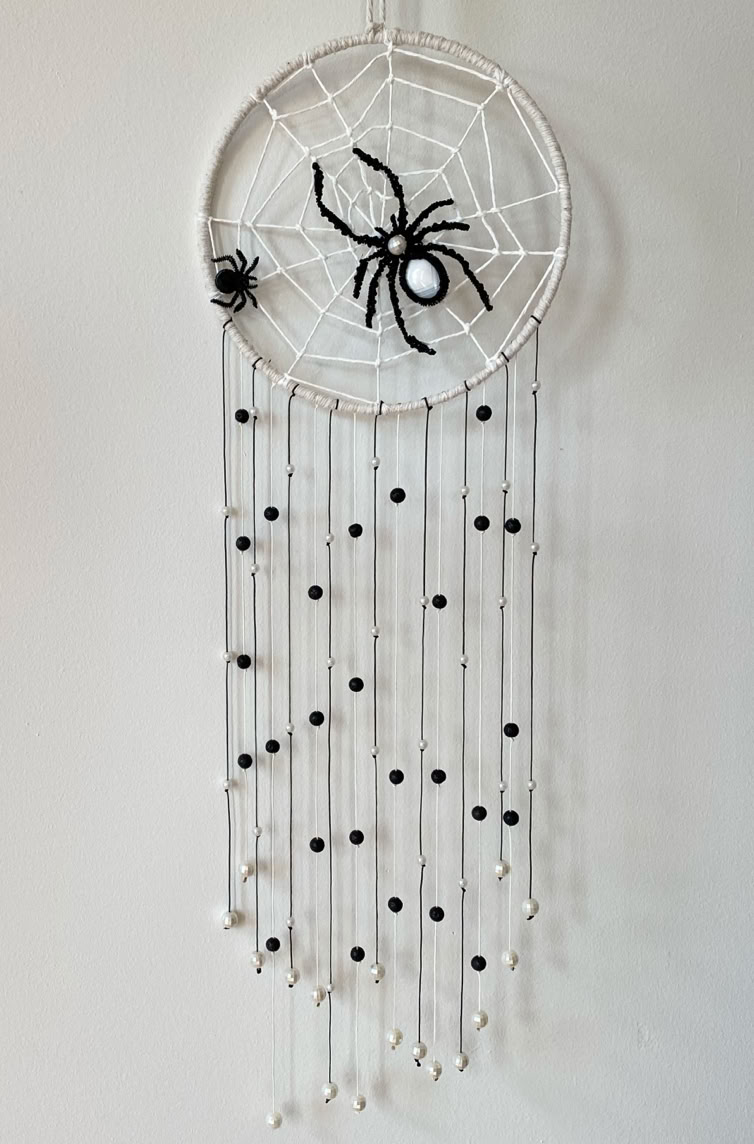 Beautiful macrame golden bead spider dreamcatcher with long flowing black & pearl beaded tail