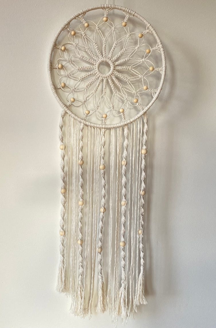 Beautiful macrame golden bead dreamcatcher with long flowing tail