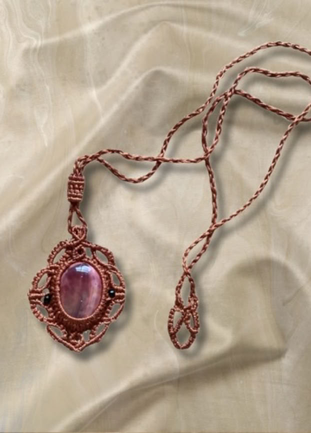 Beautifully encaptualled macrame crystal holding necklace with adjustable strapping